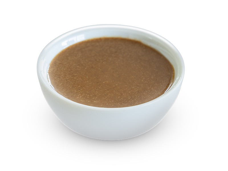 Smooth hazelnut puree in a bowl